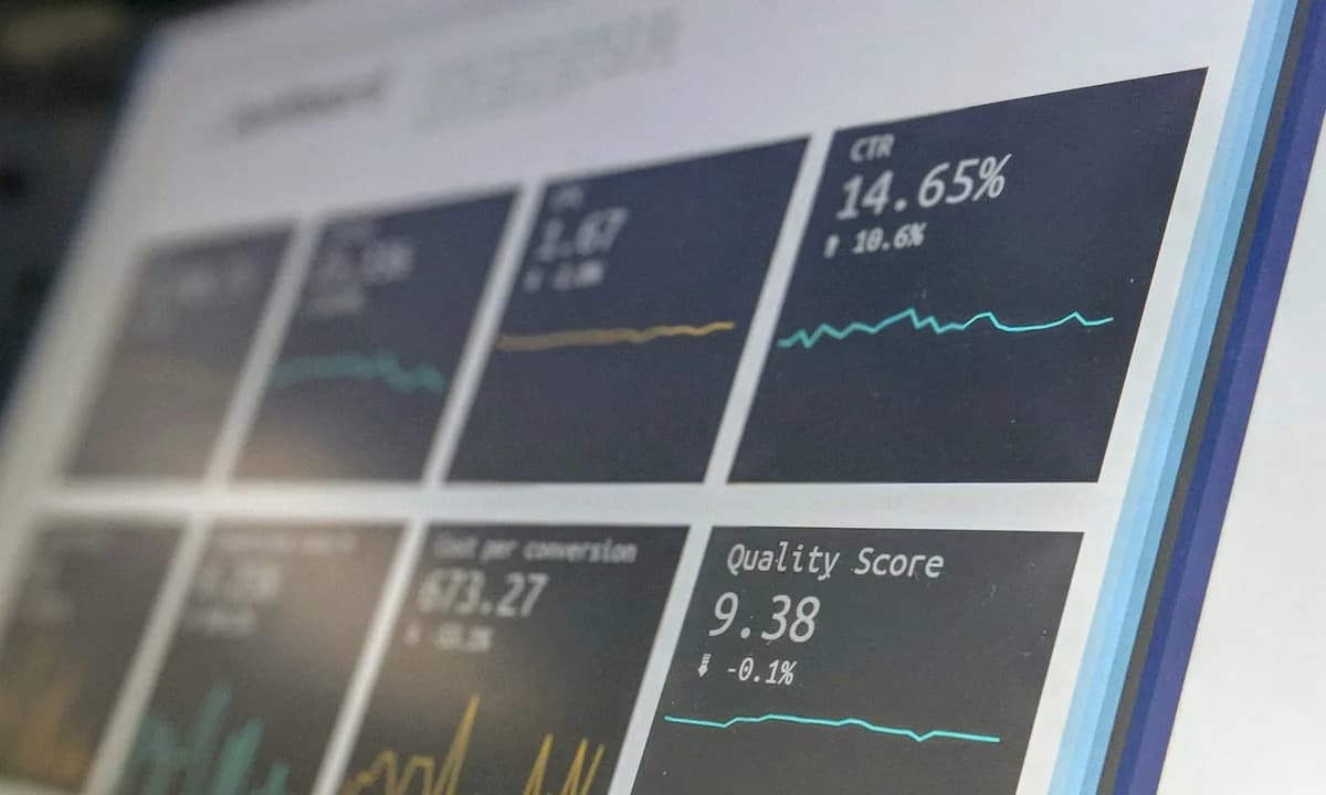 Wall-mounted monitoring dashboard showing live metrics